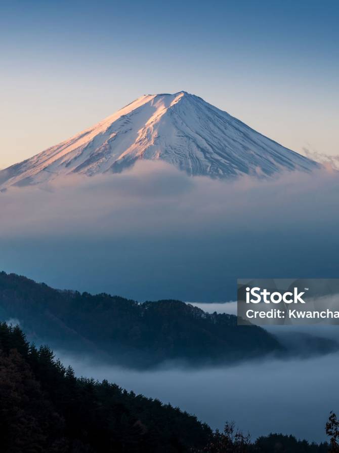 istockphoto-601394220-2048×2048 Mount Fuji enshrouded in clouds with clear sky from lake kawaguchi, Yamanashi, Japan